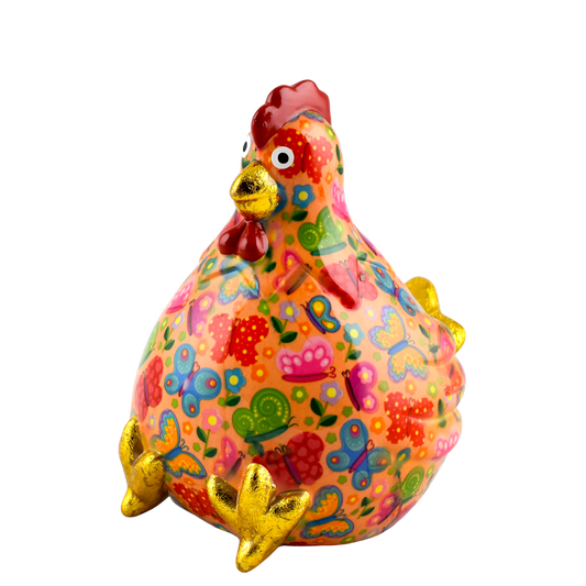 "Oranje keramische Pomme Pidou spaarpot kip Claire met vlinderprint. Een speelse en stijlvolle manier om geld te sparen, perfect als cadeau of decoratief item."