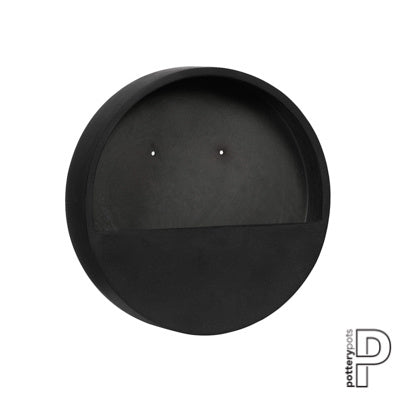 De Pottery Pots Wally wandplantenbak is een stijlvolle en robuuste plantenbak die zowel binnen als buiten gebruikt kan worden. Hij is gemaakt van fiberstone en heeft een diameter van 40 cm en een hoogte van 9 cm