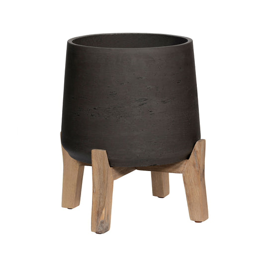 Lage zwarte plantenpot op korte pootjes van Pottery Pots, model Patt XL – gemaakt van fiberclay, geschikt voor binnen en buiten, met stoere gewassen afwerking.